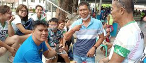 VOLLEYBALL COACH REYNANTE RAMERI WITH OTHER PLAYERS DOING PAGLAUM SIGN