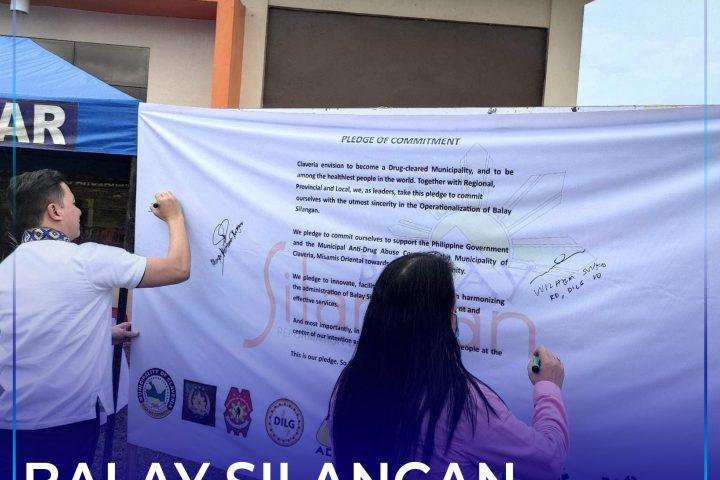 Signing of Pledge of Commitment nga giubanan nila PSWDO Head Jhunleymar Abella ug DILG- MisOr Provincial Director Engr. Marisia Naybe.